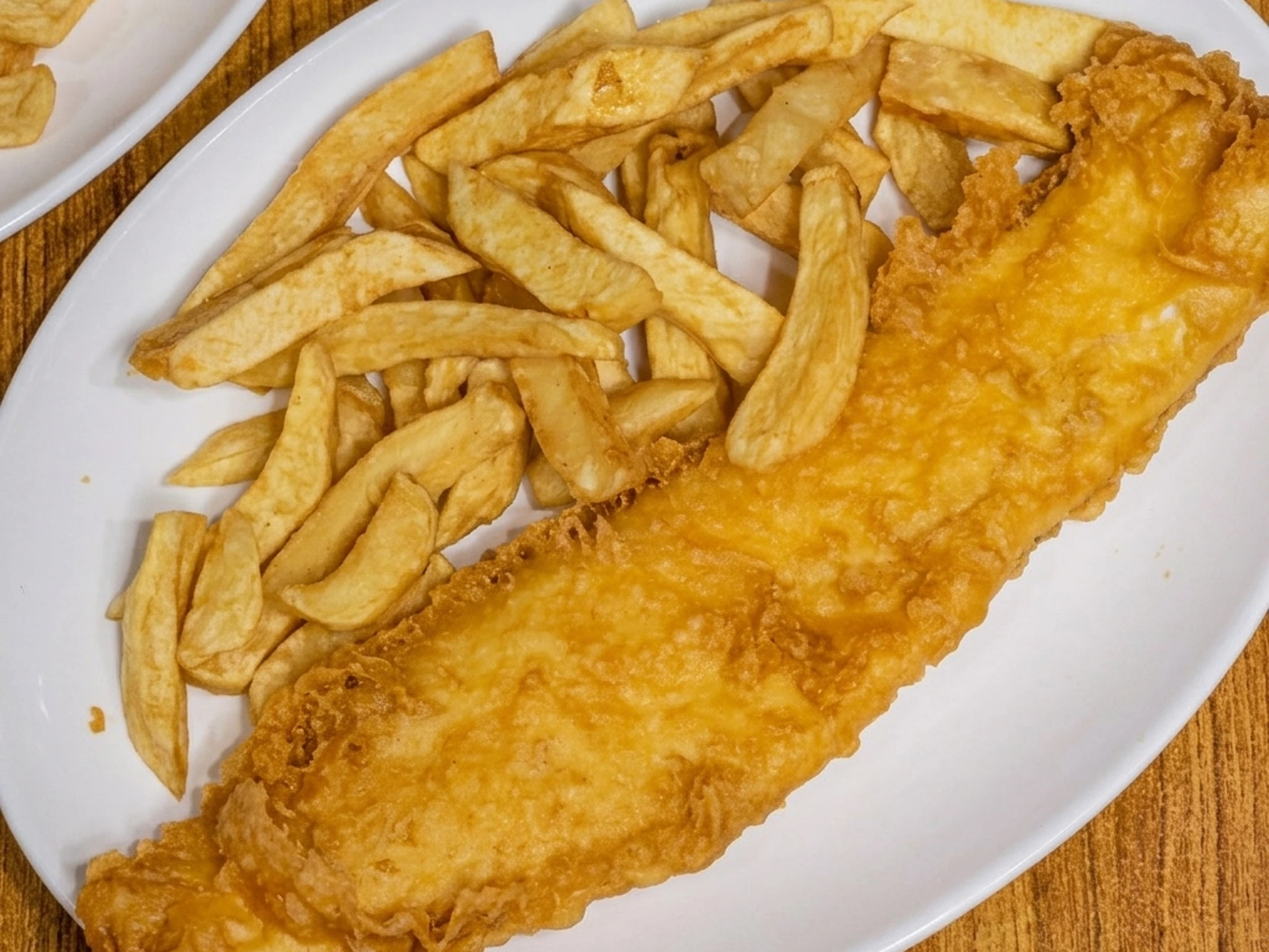 Classic fish and chips with crispy battered fish and fries at Jackson Heights Winnipeg