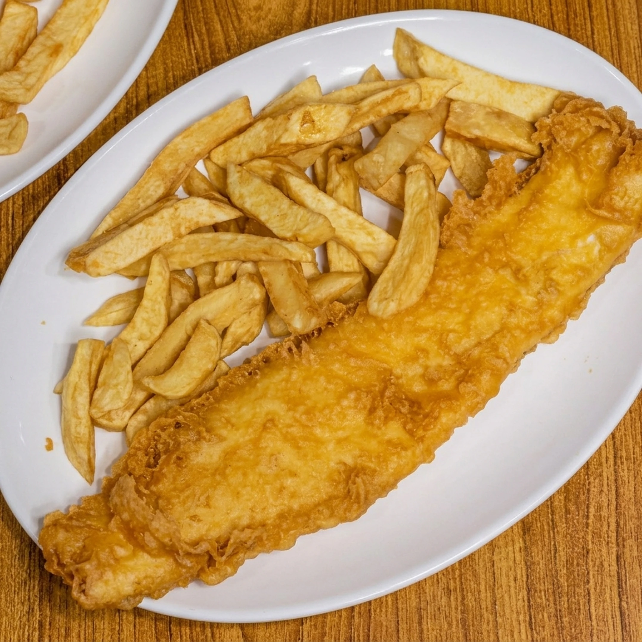 Classic fish and chips with crispy battered fish and hand-cut fries at Jackson Heights Winnipeg